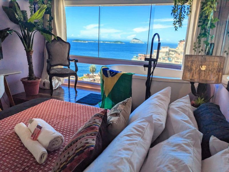The bed and the view of the sea and the islands