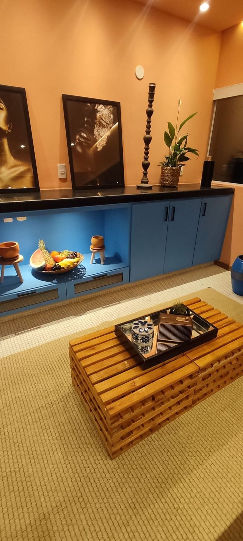 Low shelving and a wooden crate table