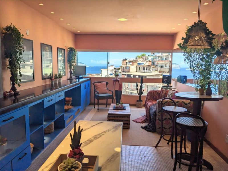 The living room, with the window over the houses and the sea