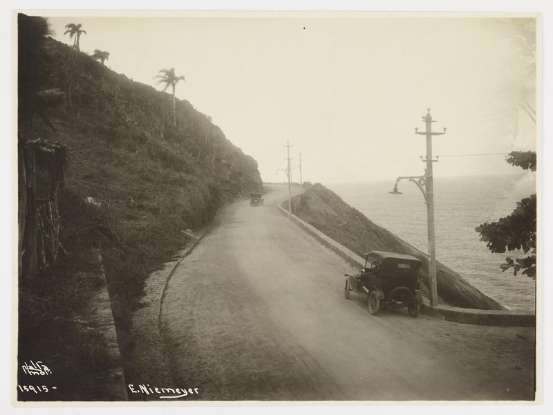 An early car on the cliff road of Avenida Niemeyer