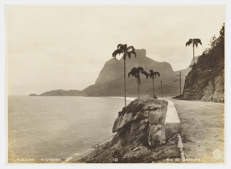 Avenida Niemeyer along the sea with palm trees and Pedra da Gávea, about 1915 to 1925